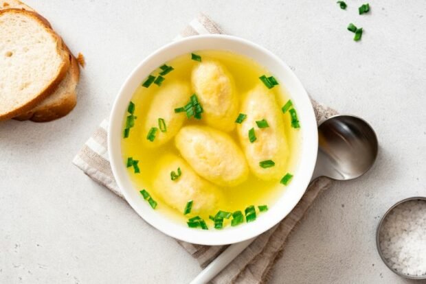 Golden soup with corn dumplings 