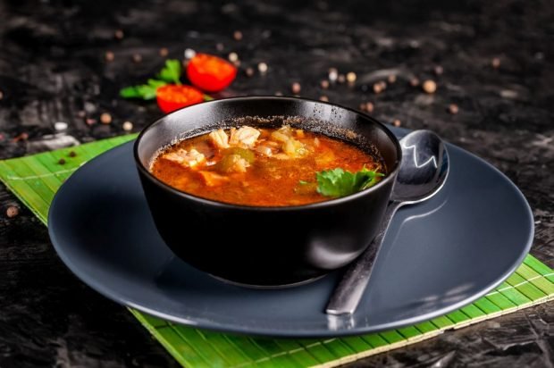 Trout soup with tomato paste and vegetables