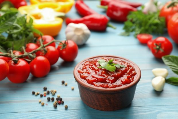 Adjika of tomatoes with garlic and pepper for winter 