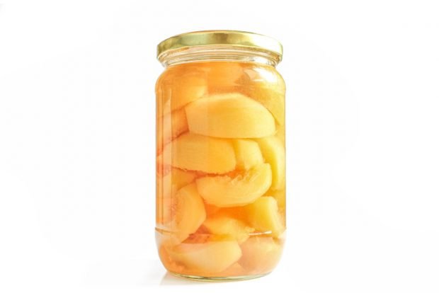 Canned compote of peeled peaches