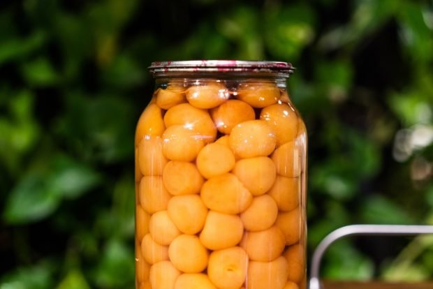 Compote of yellow cherry plum for winter with seeds