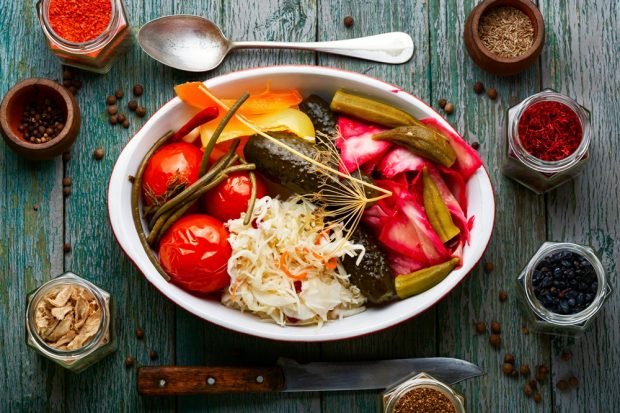 Sauerkraut with tomatoes for winter in cans