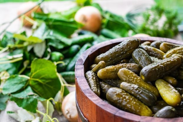 Pickled cucumbers with grapes for winter