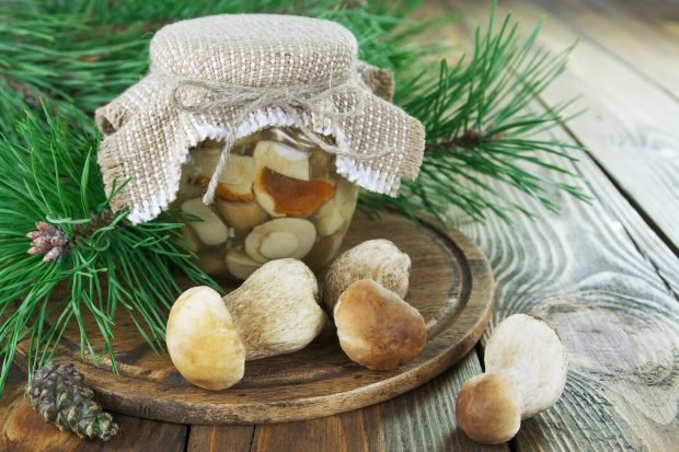 Pickled porcini mushrooms in jars for winter