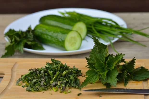 Cucumbers with nettles for winter