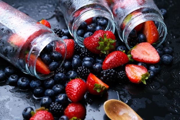 Compote of blackberries, strawberries and blueberries for winter