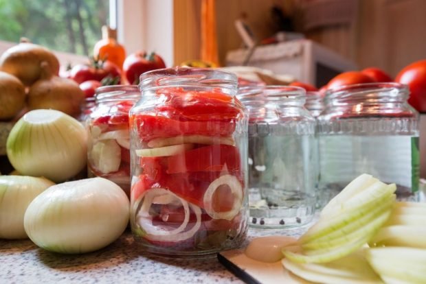 Tomatoes in gelatin with onions for winter