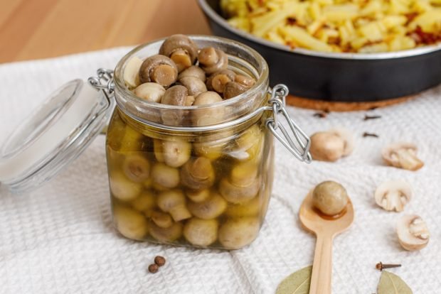 Pickled champignons with vinegar