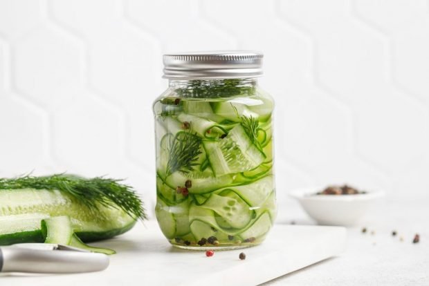 Cucumber salad with onion and dill for winter