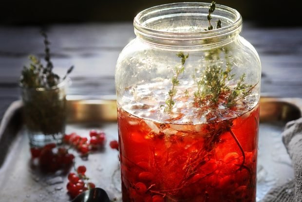 Berry compote with herbs for winter