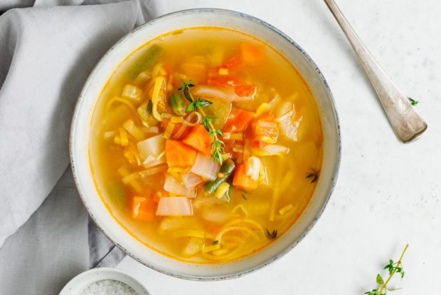 Chicken soup with turmeric and frozen vegetables 