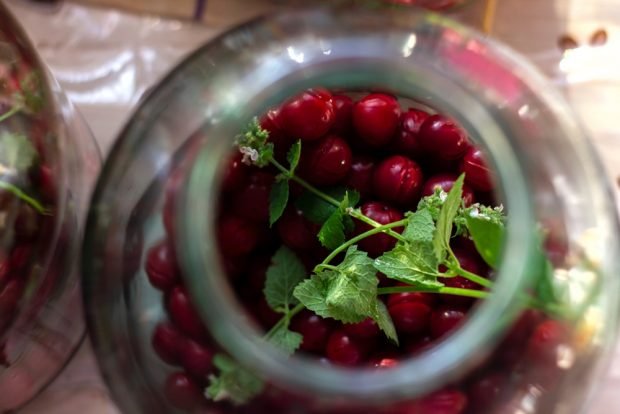 Cherry compote with mint for winter