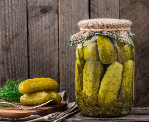 Pickled cucumbers with vinegar for winter in jars