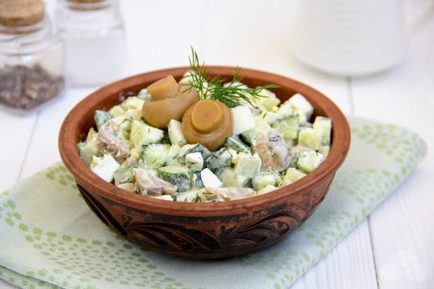 Salad with cucumbers and pickled mushrooms