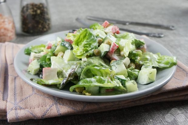 Salad with crab sticks, cucumbers and peas