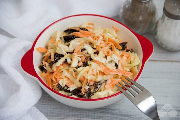 Fresh cabbage salad with prunes and mayonnaise