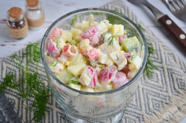 Salad with crab sticks, radishes and herbs